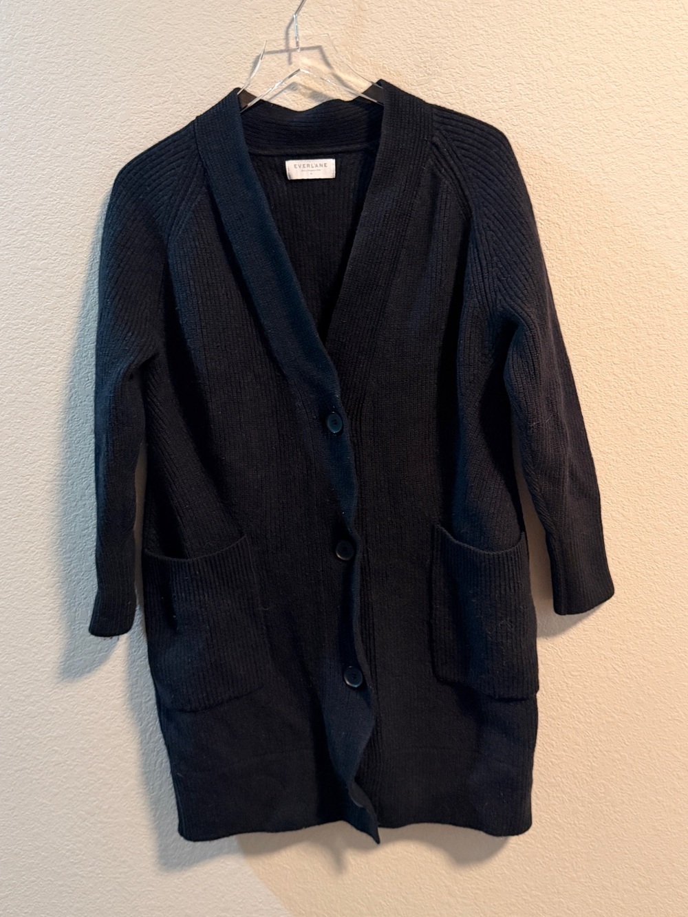 Everlane button-down cardigan sweater features ribbed texture.